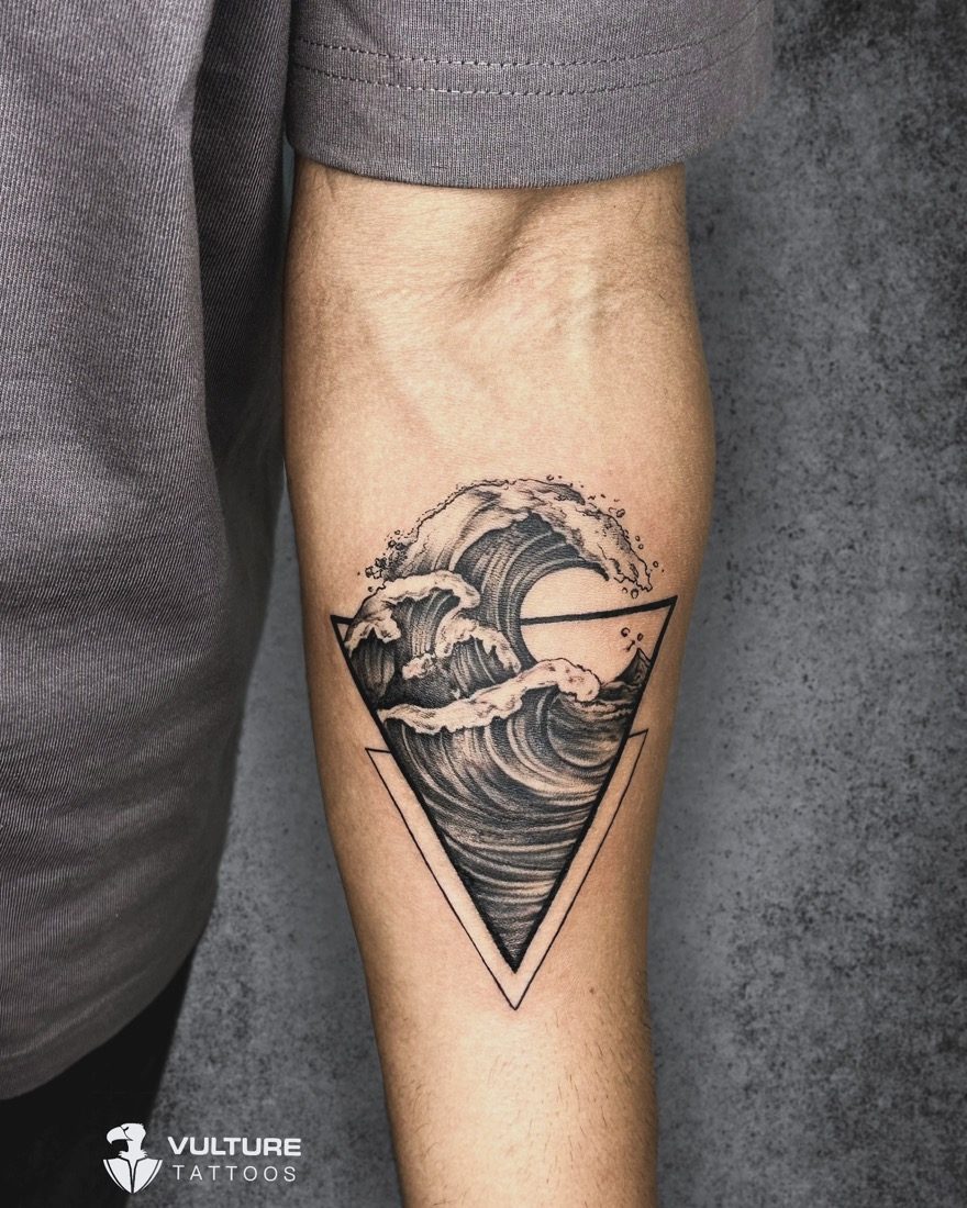 Ocean Wave In Triangle — tattoo by Vulture Tattoos, Gurugram