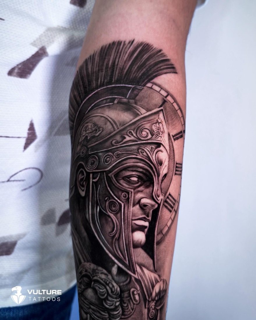 Spartan Helmet With Clock — tattoo by Vulture Tattoos, Gurugram