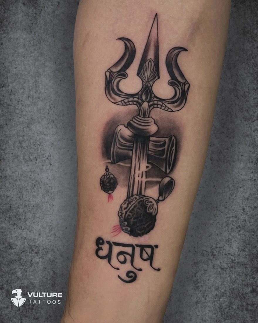 Trishul Damru Rudraksha Piece — tattoo by Vulture Tattoos, Gurugram