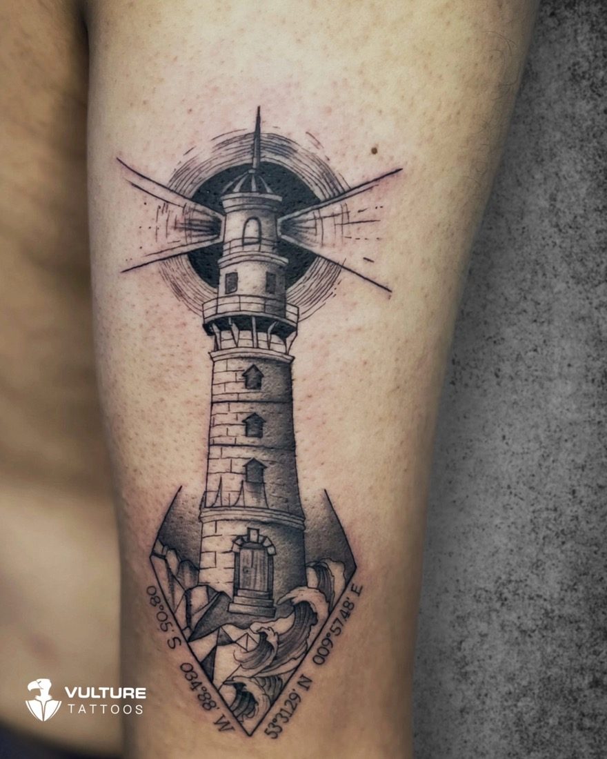 Lighthouse With Coordinates Travel — tattoo by Vulture Tattoos, Gurugram