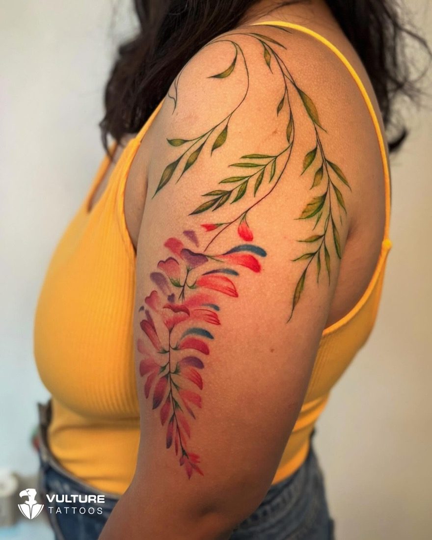 Watercolor Cascading Botanical Branch — tattoo by Vulture Tattoos, Gurugram