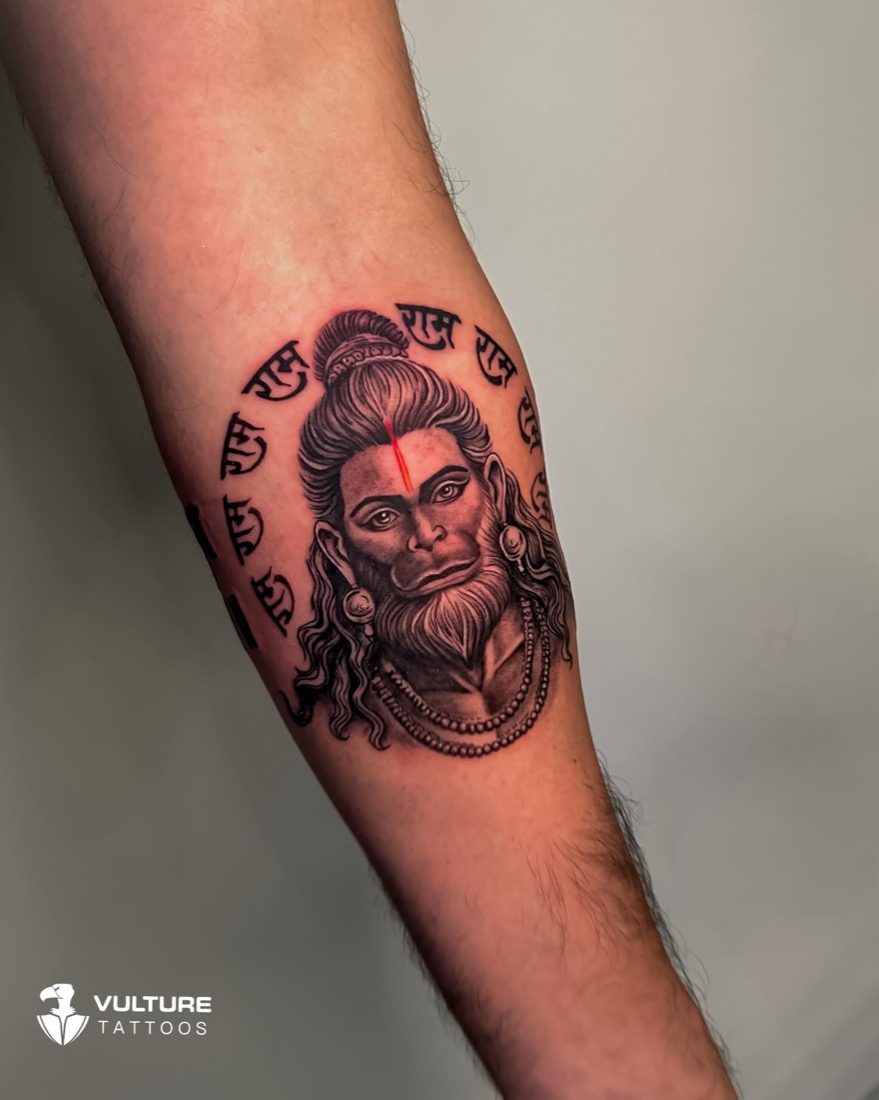 Hanuman Face And Script — tattoo by Vulture Tattoos, Gurugram