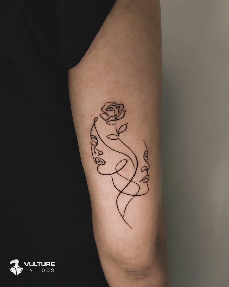 Single-Line Faces And Rose — tattoo by Vulture Tattoos, Gurugram