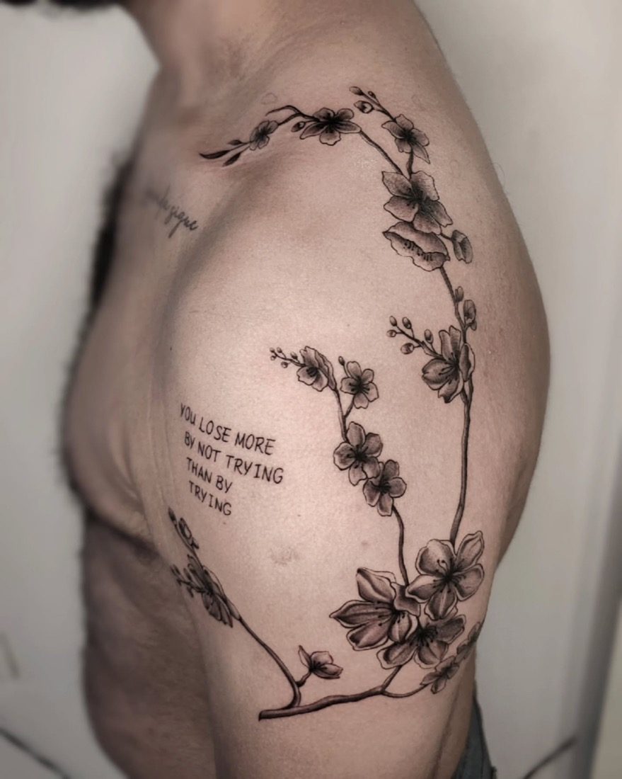 Cherry Blossom Branch With Quote — tattoo by Vulture Tattoos, Gurugram