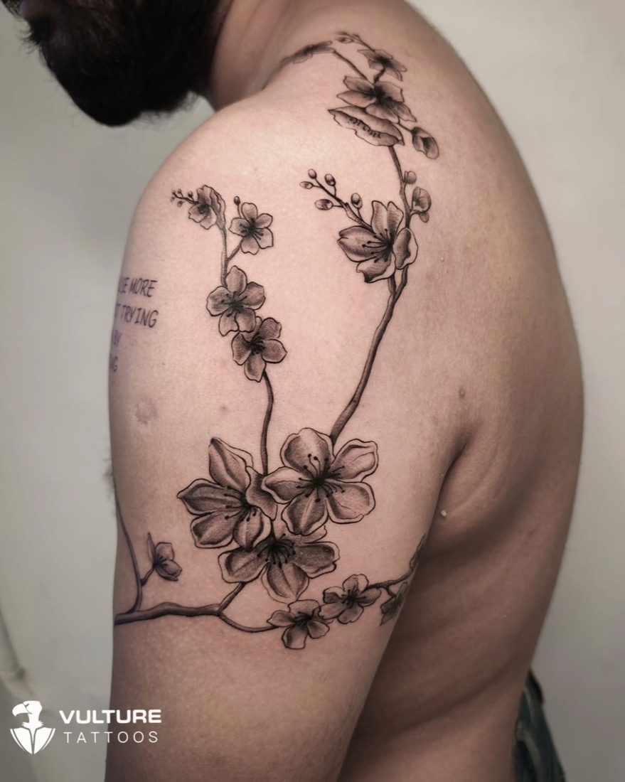 Cherry Blossom Shoulder Branch — tattoo by Vulture Tattoos, Gurugram