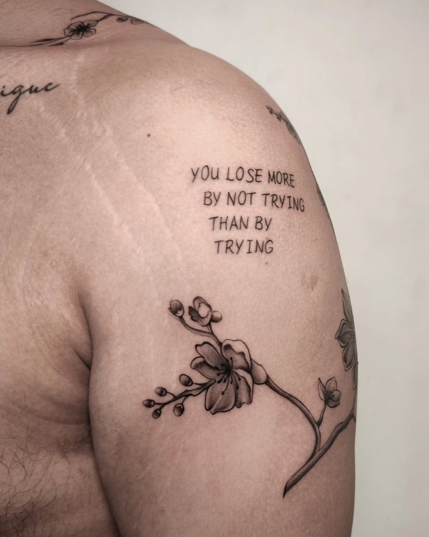 Blossom And Motivational Lettering — tattoo by Vulture Tattoos, Gurugram