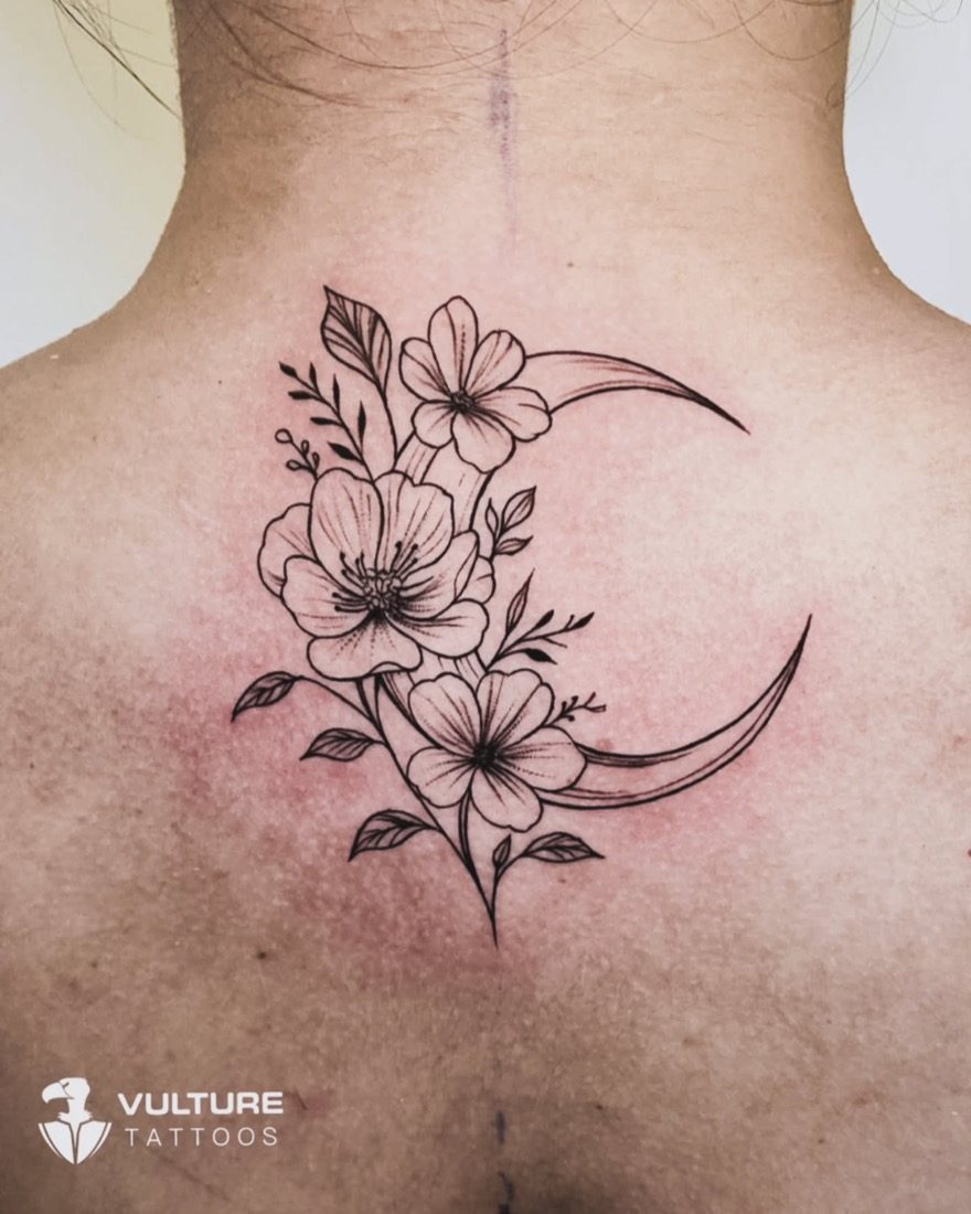 Crescent Moon Floral Spine — tattoo by Vulture Tattoos, Gurugram