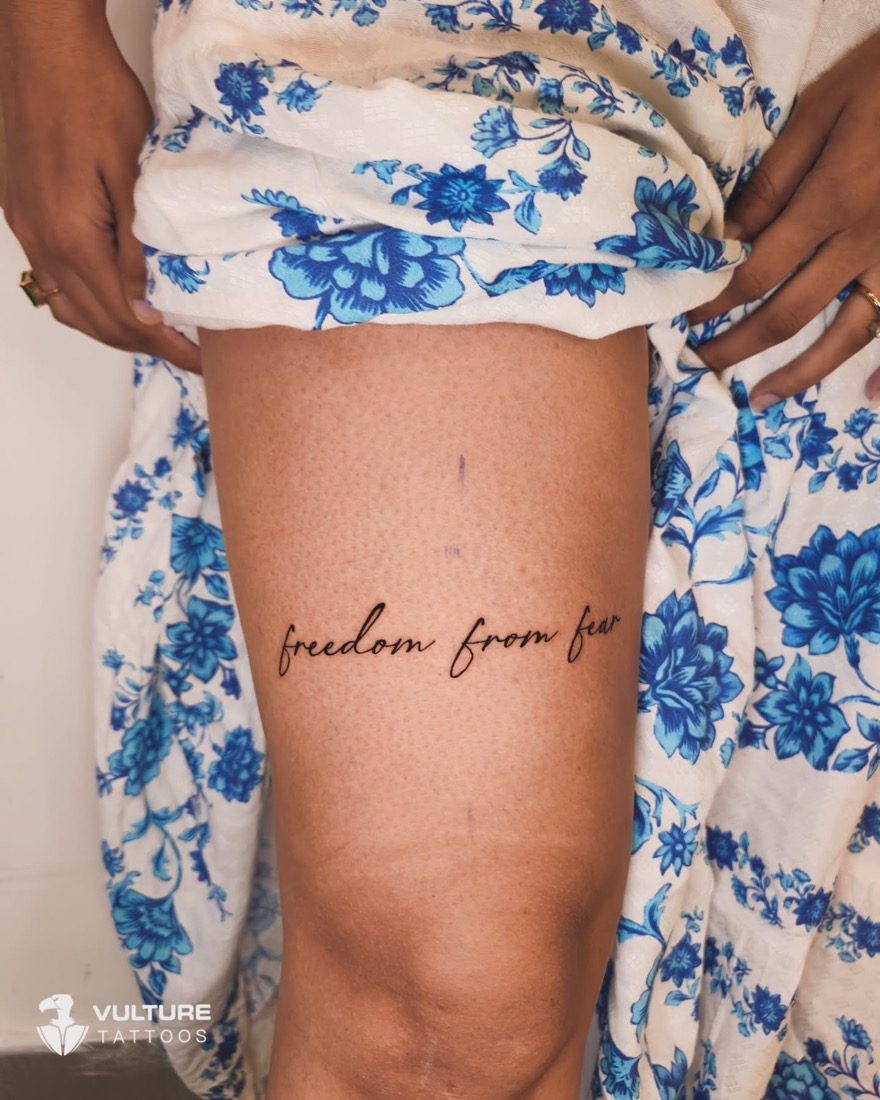 Freedom From Fear Script — tattoo by Vulture Tattoos, Gurugram