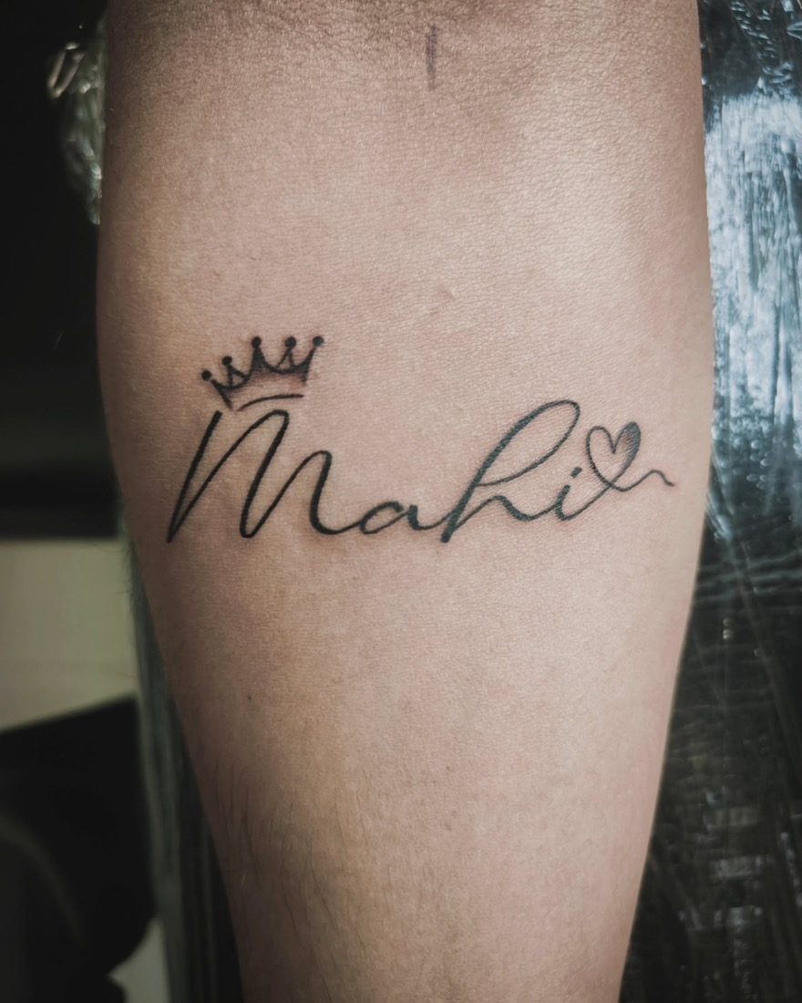 Mahi Name With Crown — tattoo by Vulture Tattoos, Gurugram