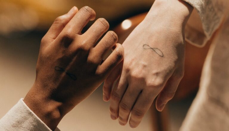 Couple matching tattoos in Gurgaon — fine-line wrist tattoos at Vulture Tattoos