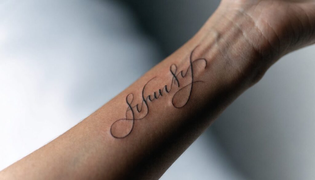 Name and script tattoo in Gurgaon — fine-line calligraphy at Vulture Tattoos