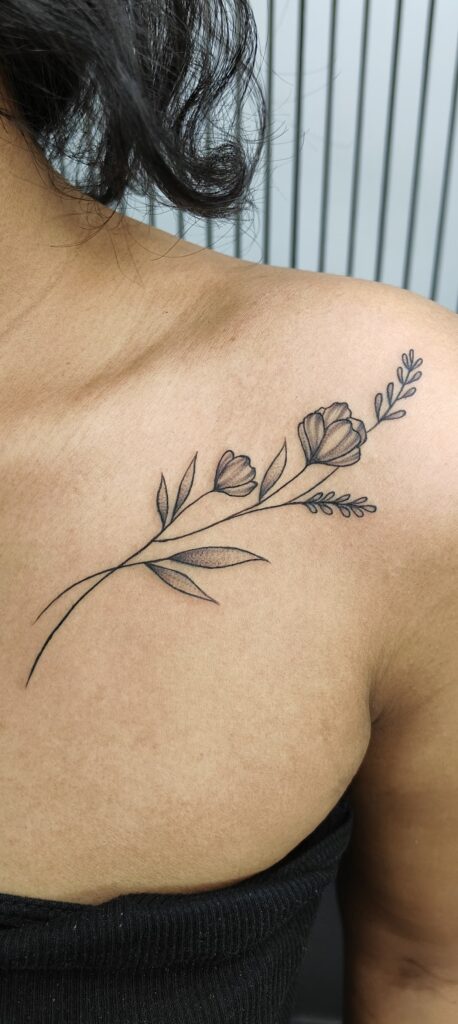 Fine-line floral tattoo on forearm, Vulture Tattoos Gurgaon