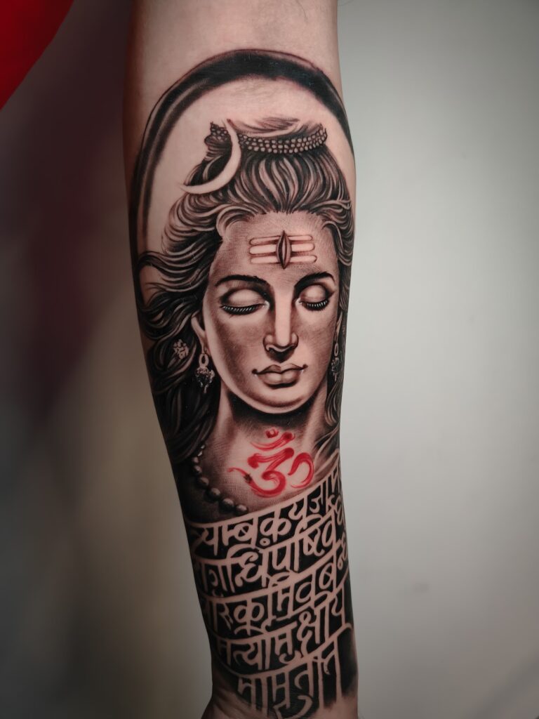 Mahadev face tattoo in black and grey on forearm, Vulture Tattoos Gurgaon