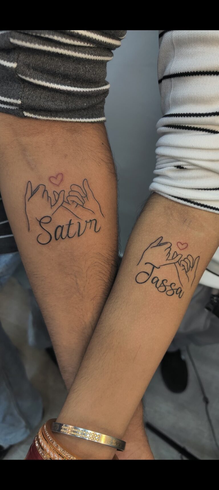 Two matching fine-line tattoos on friends' forearms, Vulture Tattoos Gurgaon
