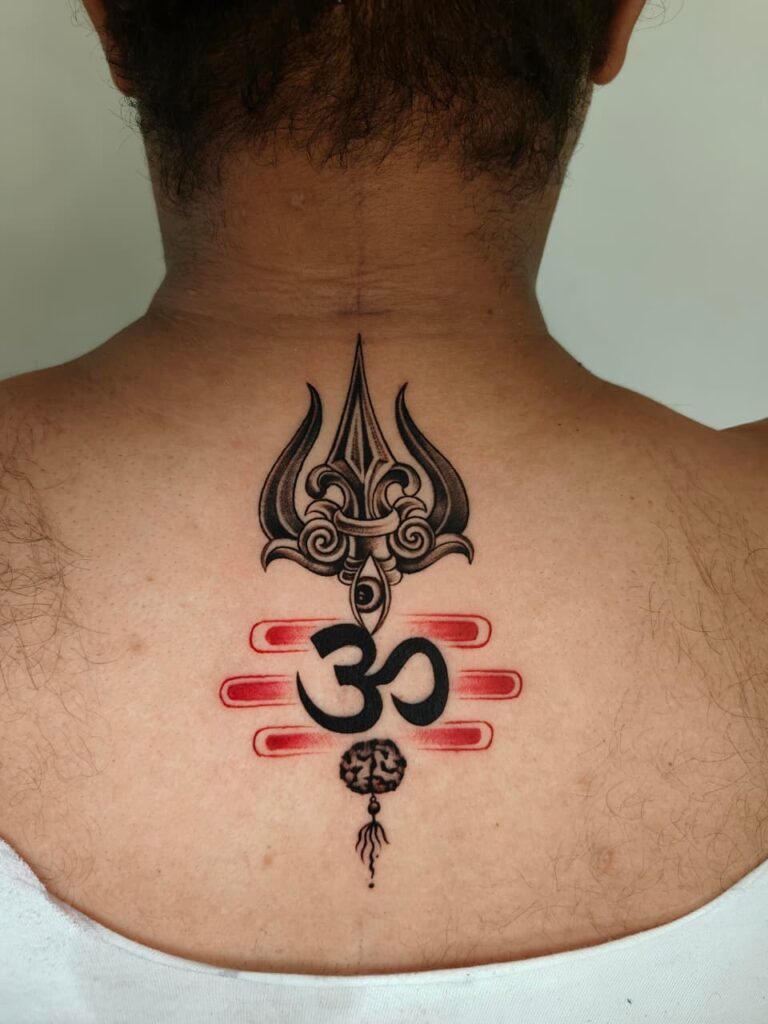 Om tattoo with trishul and rudraksha beads on forearm, Gurgaon