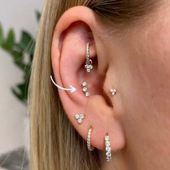 Tragus piercing with a titanium labret stud, Vulture Tattoos Gurgaon